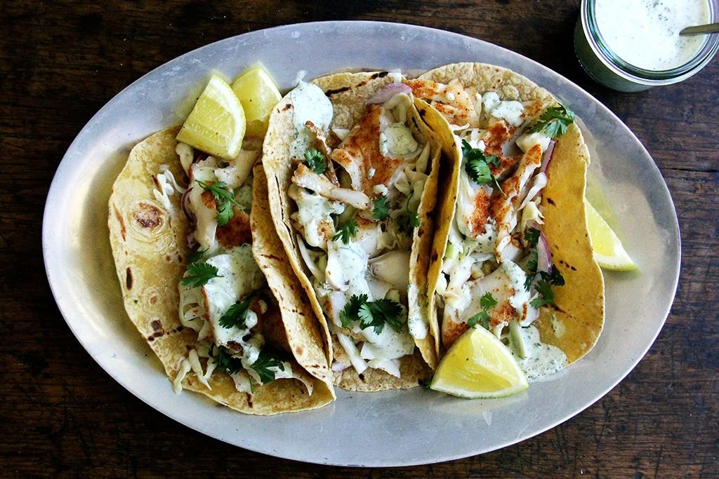 https://images.food52.com/S49YSifUFDdcJ9KGM1fFHsIij_Y/3bea758b-fcac-4094-abaa-11682a5761c1--6_fishtacoswithcilantrolimecrema.jpg