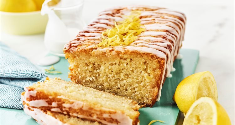 https://recipekeepers.com/wp-content/uploads/2026/04/vegan-lemon-drizzle-slice-cut.jpg
